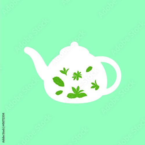 white teapot with green tea