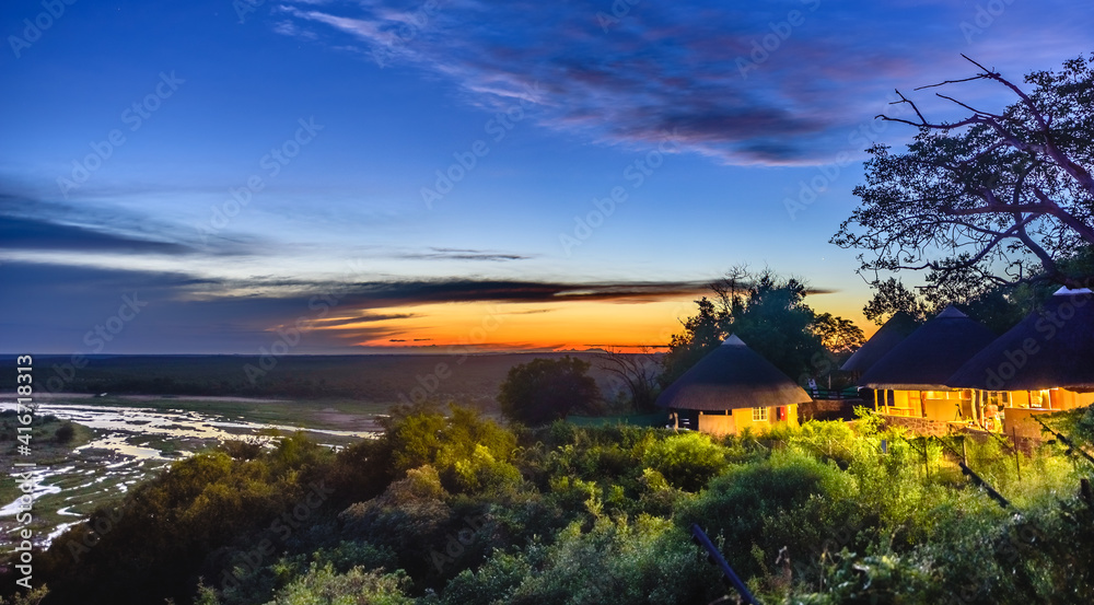 A colourful dusk over the Olifants river and a restcamp in Kruger NP, South Africa.