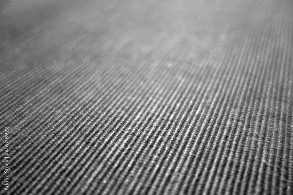 Gray color textile pattern close-up with blur effect. Gray color textile pattern close-up with blur effect.