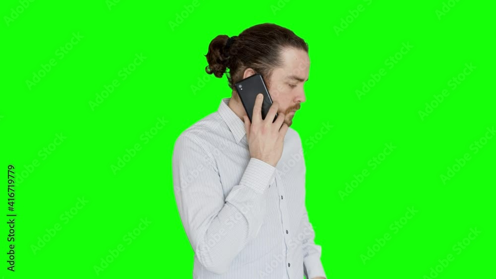 Office man wearing a white shirt gets a phone call.
Man with long hair, beard and bun uses his smartphone in the office. Green screen. Office man wearing a white shirt gets a phone call.
Man with long hair, beard and bun uses his smartphone in the office. Green screen.
