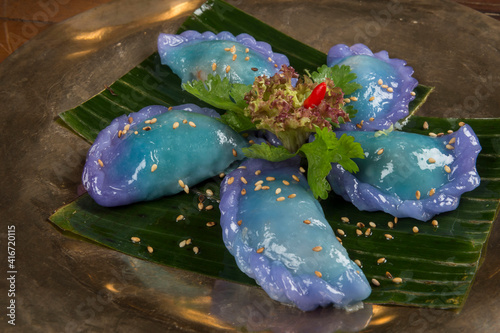 Kanom Gib Thai, rice dumpling with steamed mauve tea leaves. blue dumpling