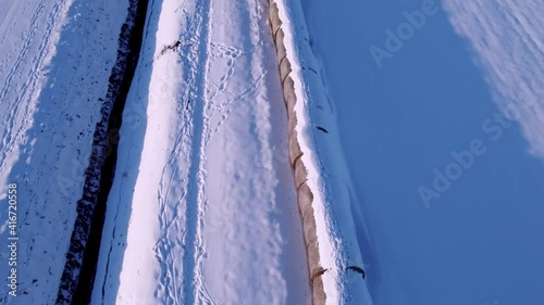 bale of straw covererd in snow photo