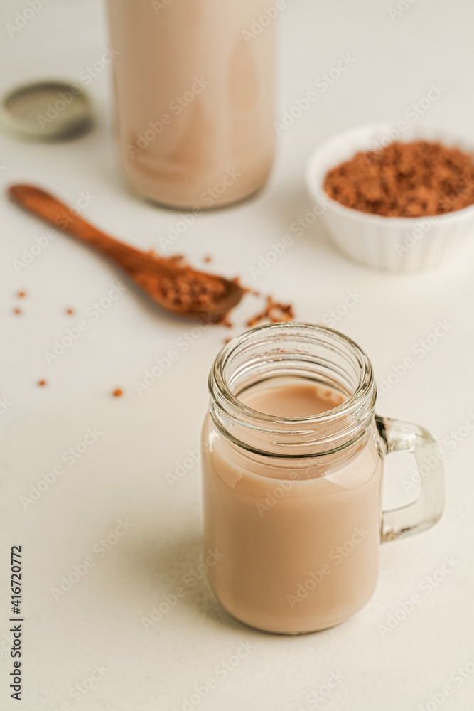 Non dairy buckwheat milk in glass jar, closeup view Non dairy buckwheat milk in glass jar, closeup view