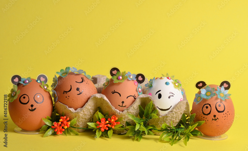 Easter eggs with flowers on a yellow background. Spring. Easter. Easter eggs with flowers on a yellow background. Spring. Easter.