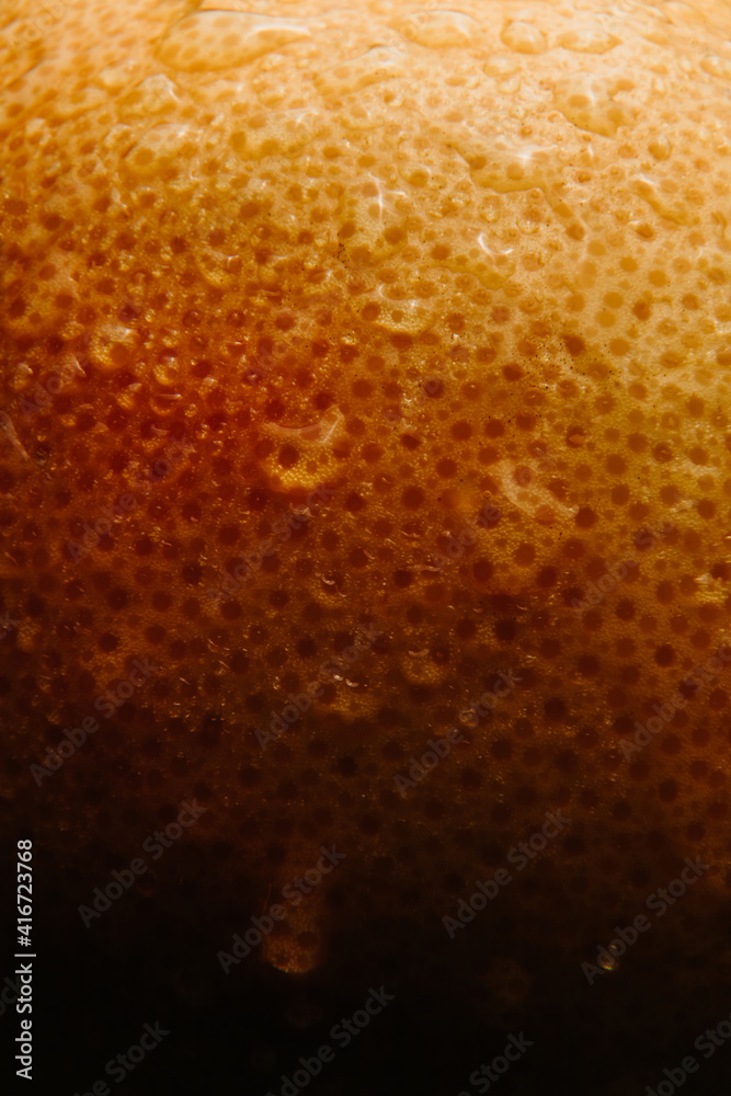 Grapefruit close-up with drops, splashing water, fresh fruit. Grapefruit close-up with drops, splashing water, fresh fruit.