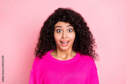 Portrait of young happy shocked amazed surprised girl sees big sale discount isolated on pink color background