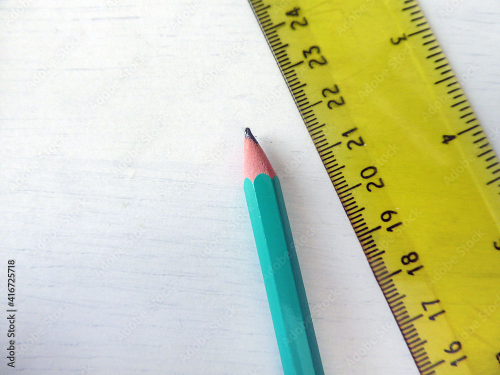 Ruler and pencil on a white background Ruler and pencil on a white background
