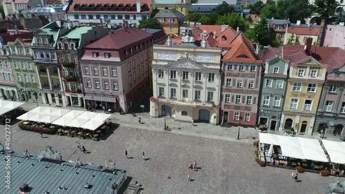 View from the drone on the old market square in Poznań. In the foreground, a church hoop. Historical tenement houses in the background.