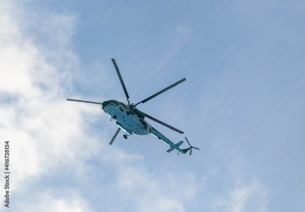 Helicopter in the winter sky Helicopter in the winter sky