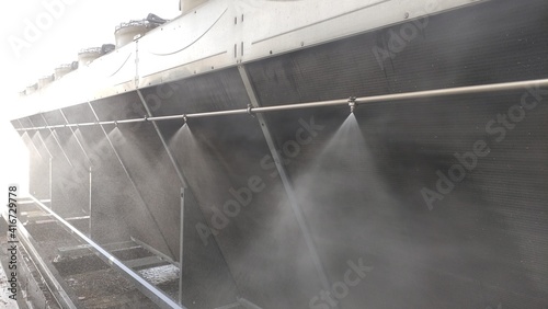 Cooling system for industrial heat exchangers. Industrial fan cooling tower.  Cooling Tower of Power Plant. Cooling tower adiabatic cooling system. Metal industrial air cooling system vent. 