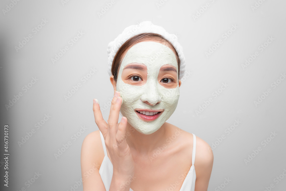 Beauty Face Care. Portrait Of Young Asain Girl Touching Her Perfect Soft Facial Skin. Over white background. Beauty Face Care. Portrait Of Young Asain Girl Touching Her Perfect Soft Facial Skin. Over white background.