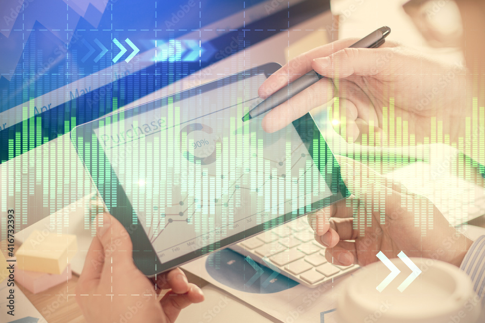 Double exposure of man's hands holding and using a phone and financial chart drawing. Market analysis concept. Double exposure of man's hands holding and using a phone and financial chart drawing. Market analysis concept.