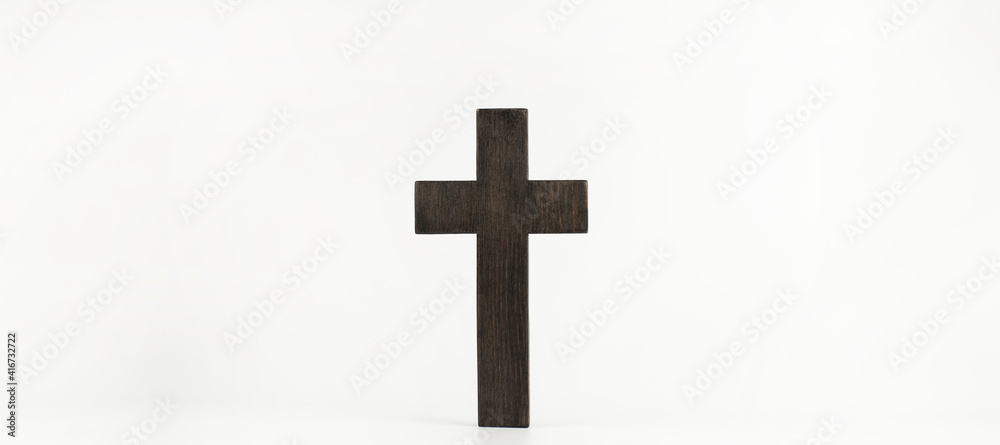 Wooden cross Jesus on a white background. Christian religious symbol.