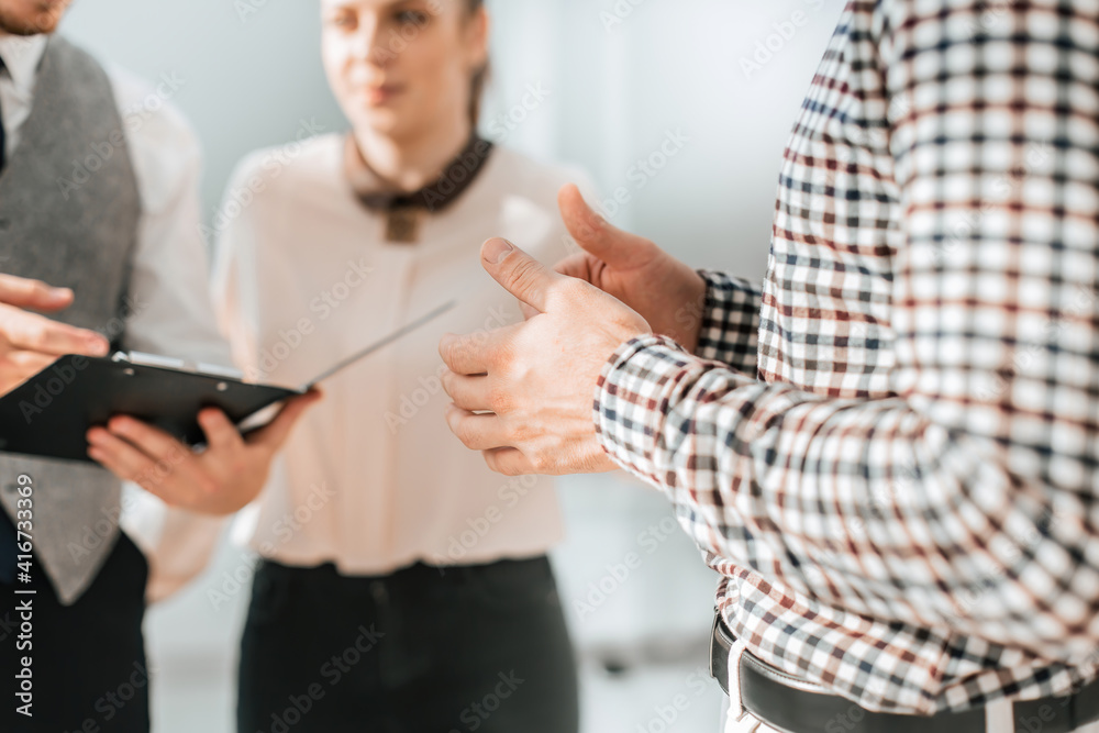 close up. business man discussing with colleagues business documents close up. business man discussing with colleagues business documents