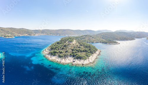 Fototapeta Naklejka Na Ścianę i Meble -  Aerial drone shot of stone Fort George Croatia on top of hill in Adriatic sea on Vis Island in summer