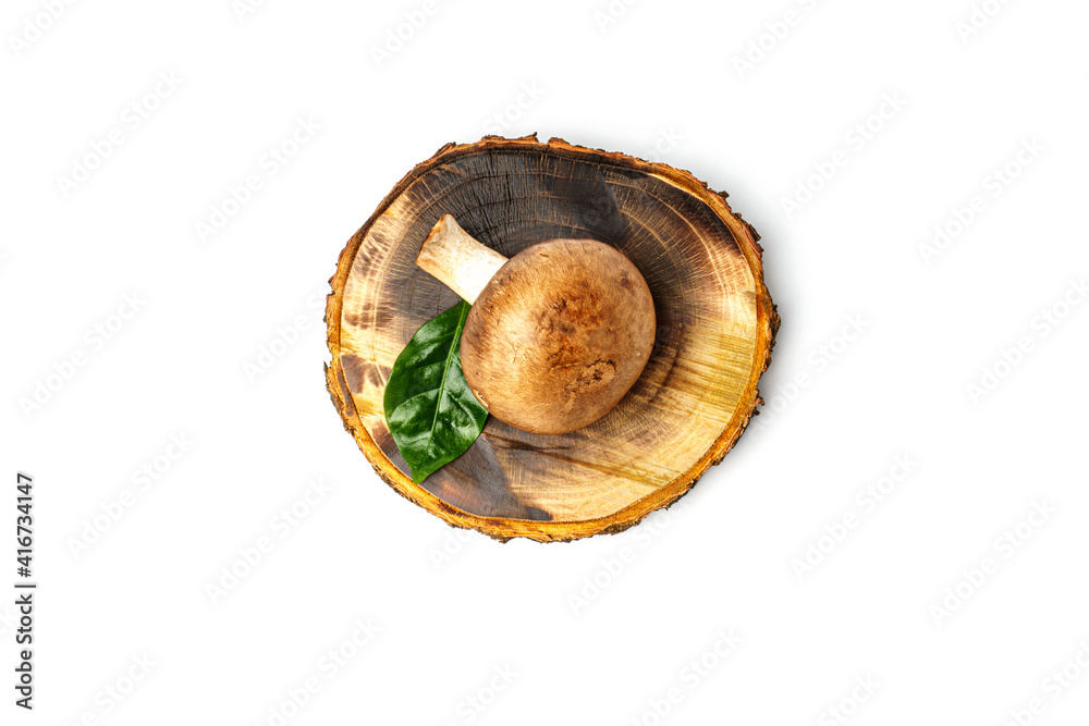 royal mushroom decorated with herbs on a round wooden board isolated on white royal mushroom decorated with herbs on a round wooden board isolated on white