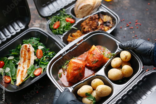 Takeaway food in a box. Ready prepared meal in a box. Tasty catering delivered to the office.