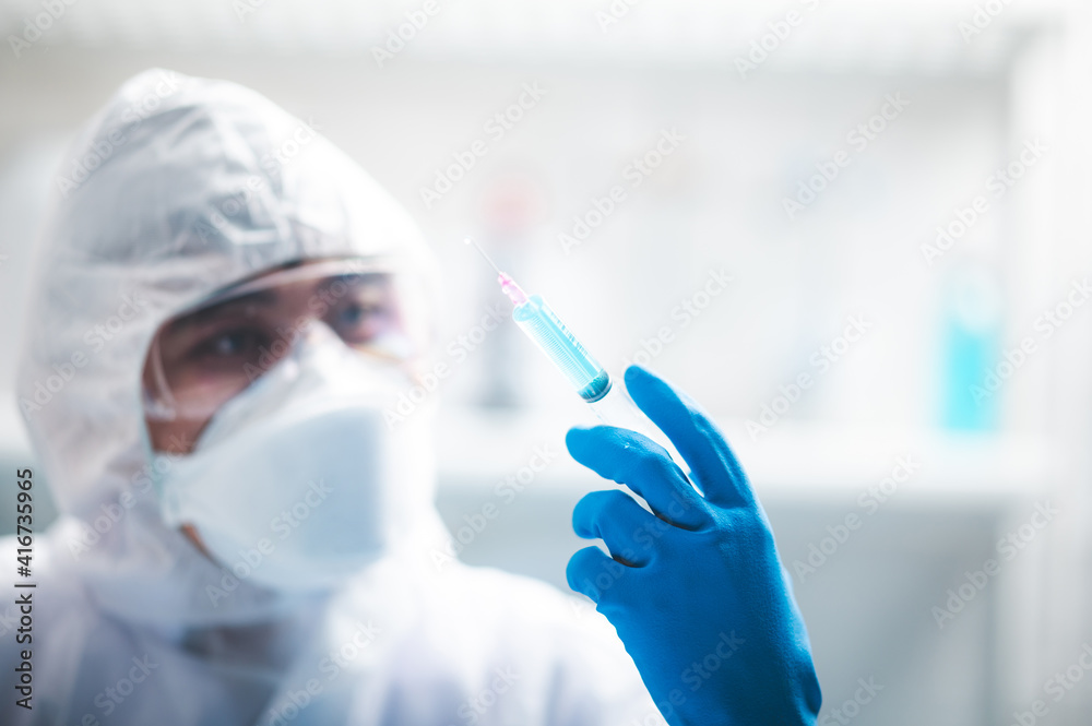 Researchers scientist working analysis with blue liquid test tube in the laboratory, chemistry science or medical biology experiment technology, pharmacy development solution Researchers scientist working analysis with blue liquid test tube in the laboratory, chemistry science or medical biology experiment technology, pharmacy development solution