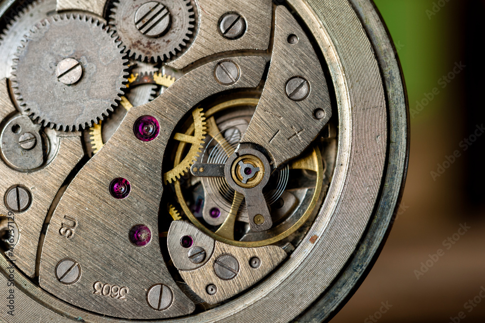 vintage old mechanism with gears and springs, clock mechanism close-up. 