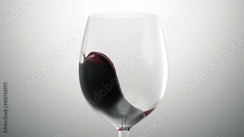 Red wine is poured from bottle into a glass on gradient background in Slow Motion with Transparent Alpha Matte
