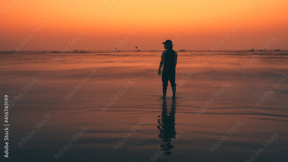 A man standing near beach