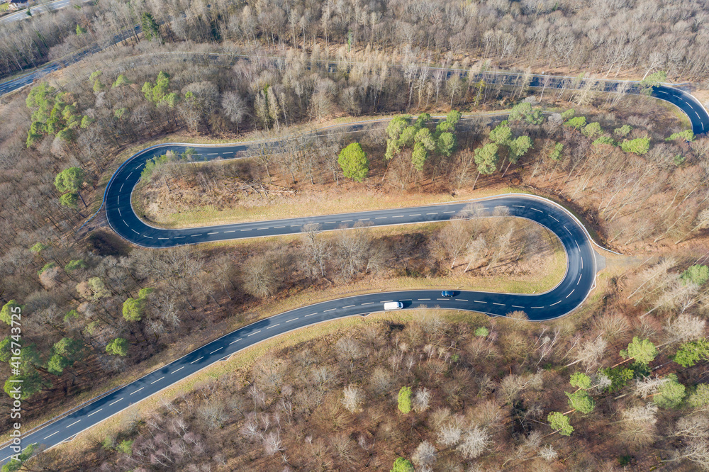Looking straight down on a winding road in the Taunus / Germany on a snow-free day in winter 