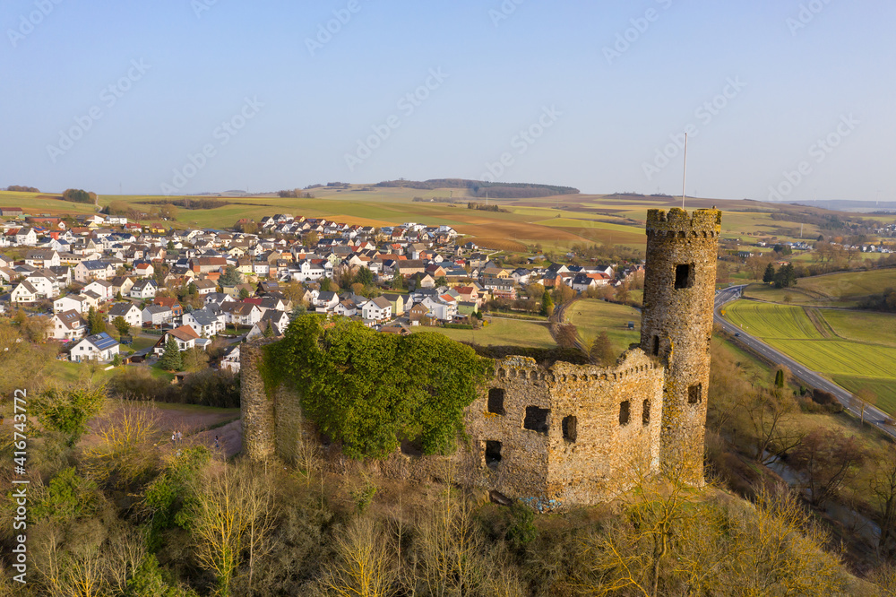 Bird's eye view of the Ardeck castle ruins near Holzheim / Germany in the Aar valley in the warm evening light 