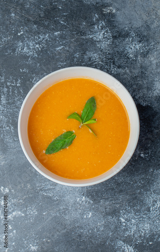 Vertical photo of tomato soup in bowl
