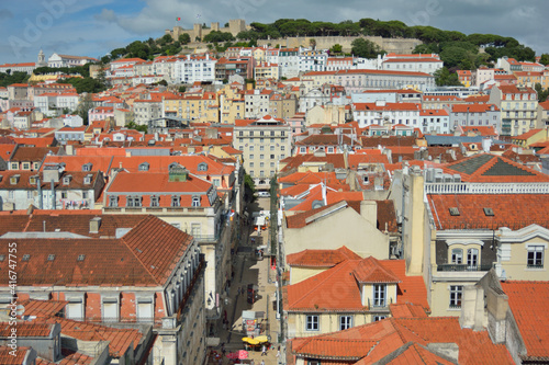 top view over the orange roofs of lisbon on a beautiful sunny day