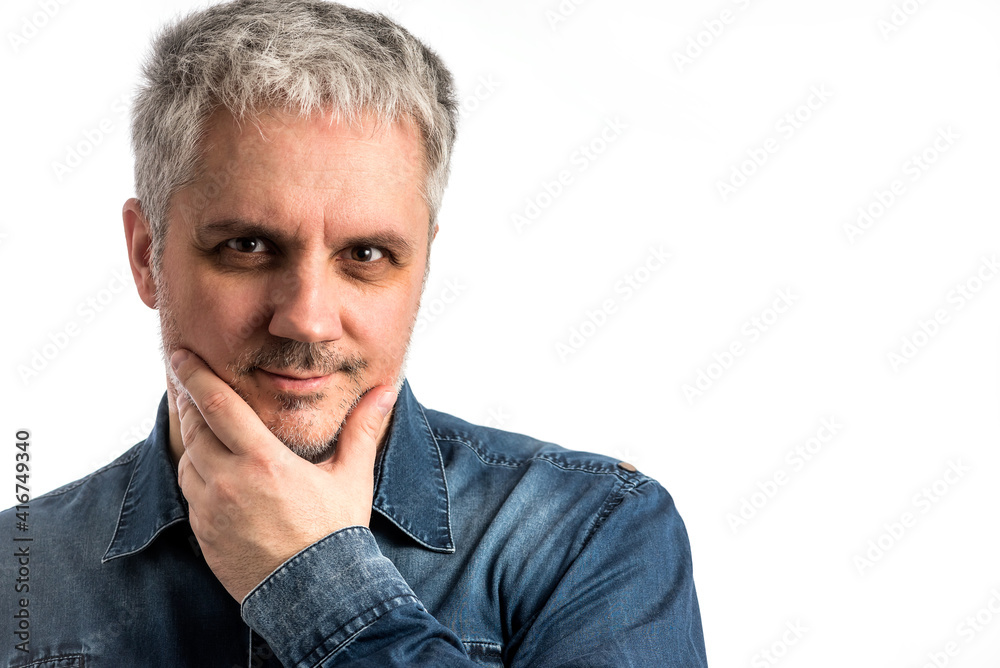 Middle age man in blue jeans shirt with pondering thinking thoughtful expression - isolated on white background with clipping path included