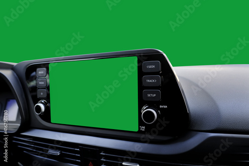 Green navigation screen on dashboard and green windscreen from inside of car