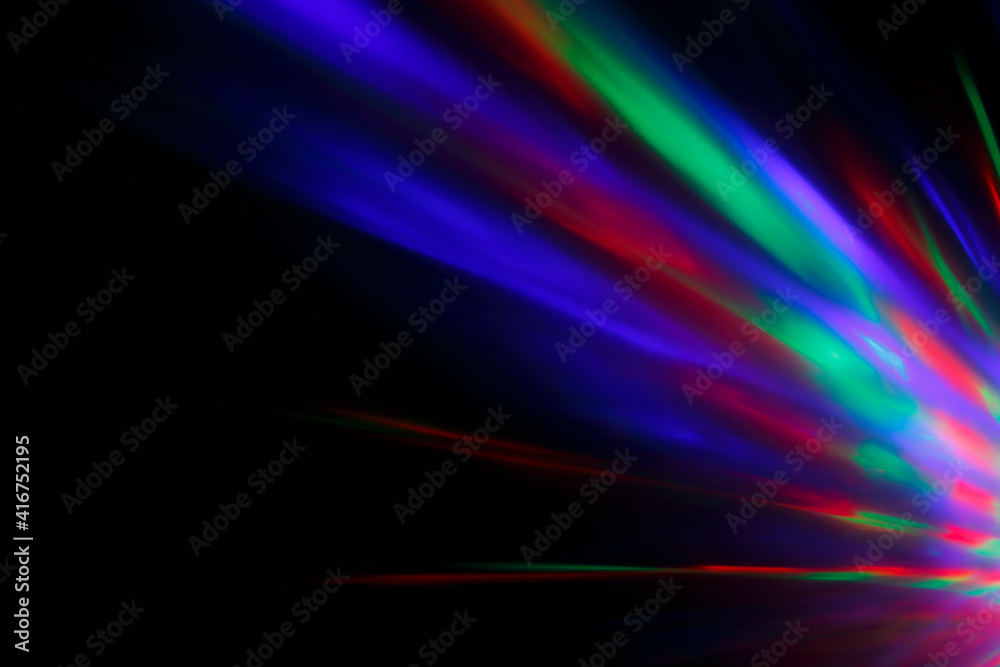 Colorful rays of light or light beams at dark. Abstract high resolution background.