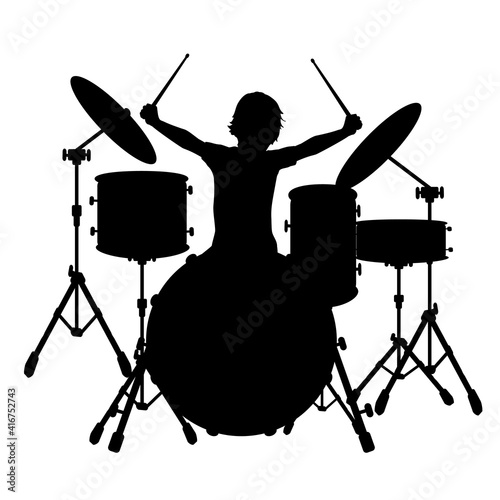 Silhouette boy music plays the percussion.