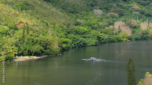 Passenger ferry crosses Ouaieme River. Hienghene, New Caledonia. Aerial. photo