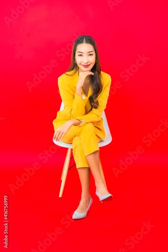Portrait beautiful young business asian woman sit on chair with smile © siraphol