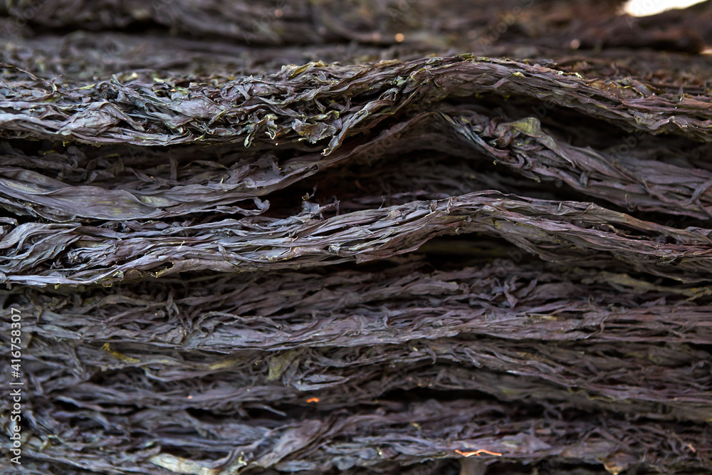 Dried seaweed stacked in a traditional market Dried seaweed stacked in a traditional market
