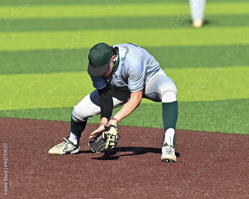 Photography Action photo of high school baseball players making plays during a baseball game