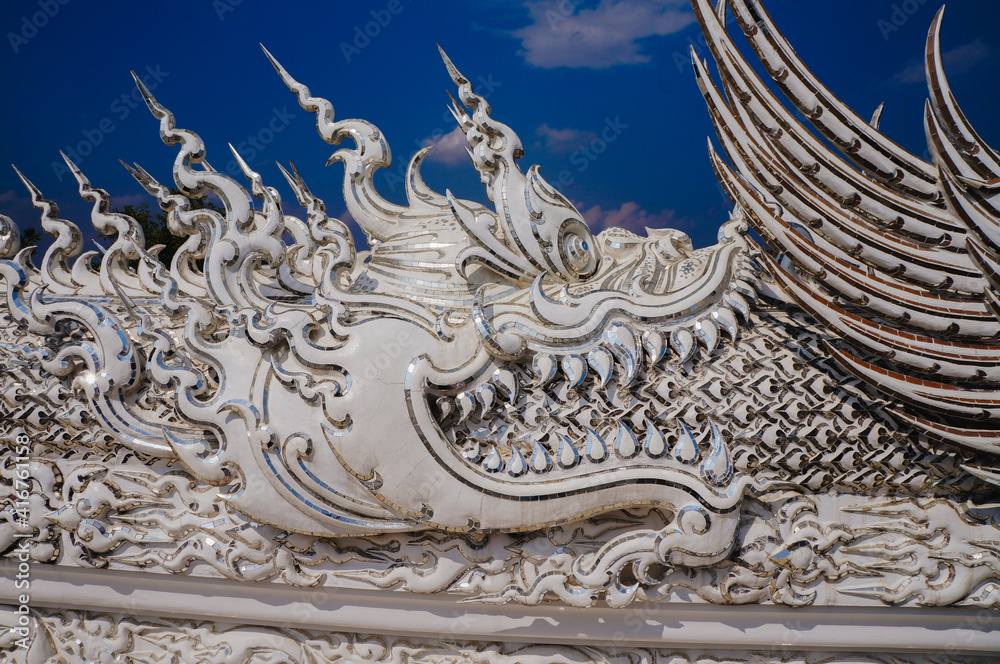 Fototapeta premium Ancient animal pattern texture pattern in Rong Khun Temple, Chiang Rai, Thailand