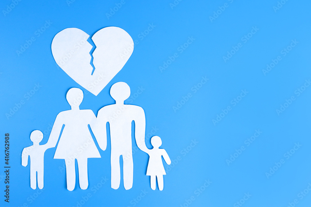 paper family and a cracked heart. The concept of divorce, family preservation paper family and a cracked heart. The concept of divorce, family preservation