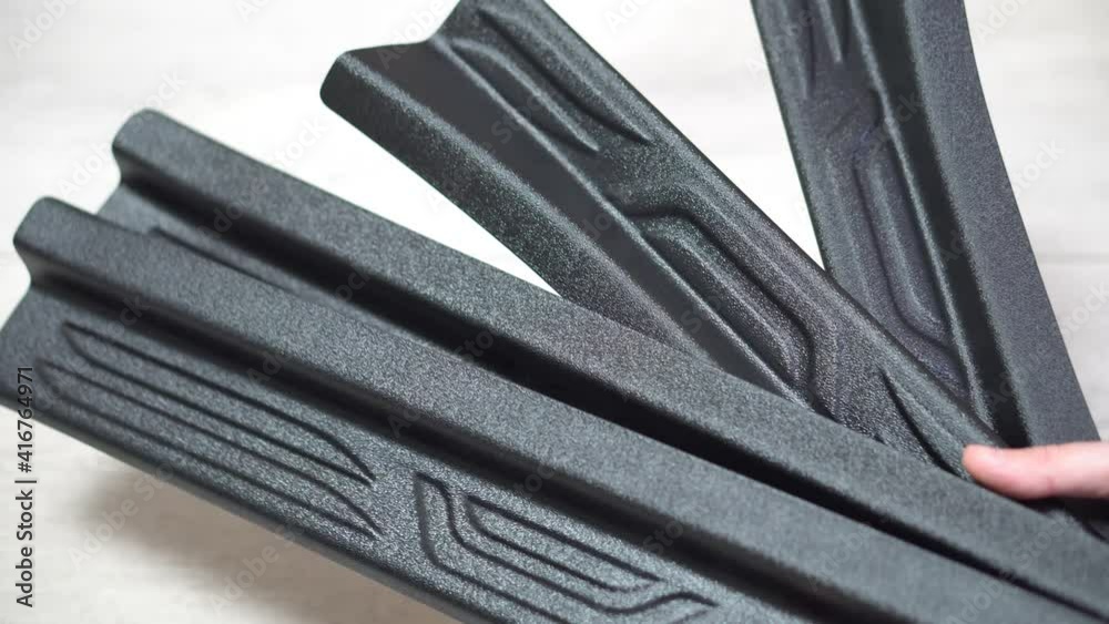 Close-up plastic door sills, plastic has a shagreen structure, car parts and accessories Close-up plastic door sills, plastic has a shagreen structure, car parts and accessories