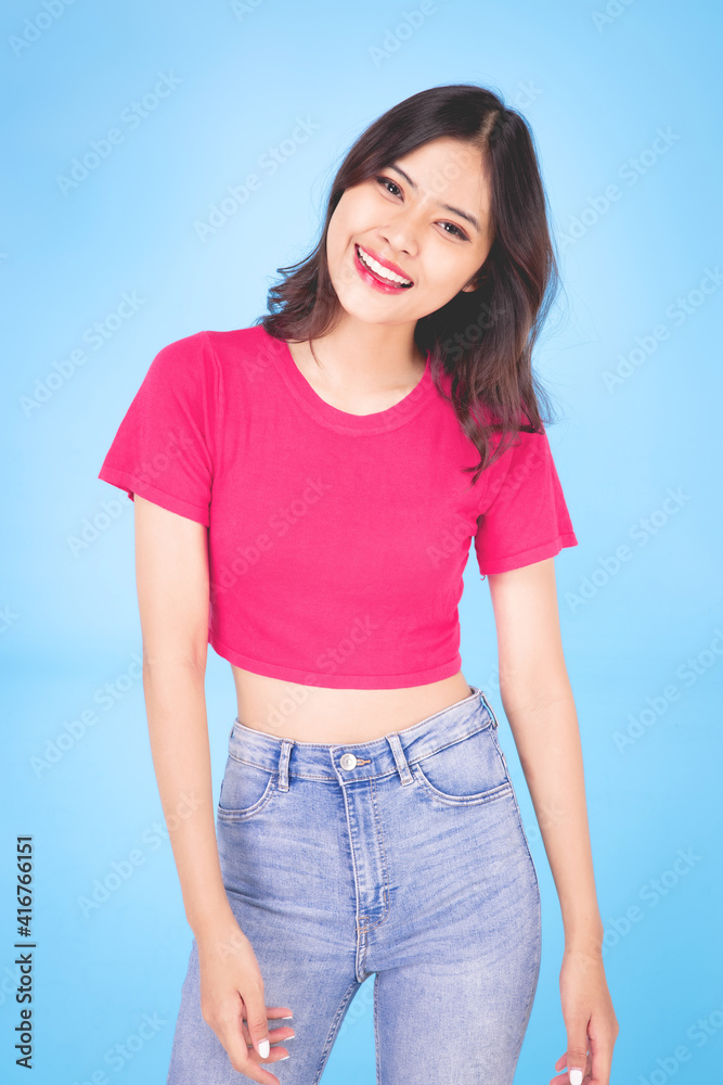 Portrait of a beautiful woman Asian teenagers With a confident, happy face, a confident, beautiful woman on a blue background. Portrait of a beautiful woman Asian teenagers With a confident, happy face, a confident, beautiful woman on a blue background.
