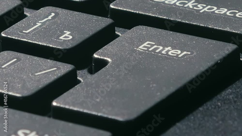 the finger presses the enter key several times. various pressing of the enter key. slow single clicks.