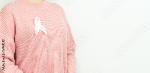 Wallpaper Mural Woman with breast cancer awareness ribbon on white background Torontodigital.ca