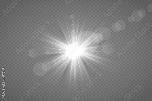 Yellow glowing light explodes on a transparent background. Sparkling magical dust particles. Bright Star. Transparent shining sun, bright flash. Vector sparkles. To center a bright flash.