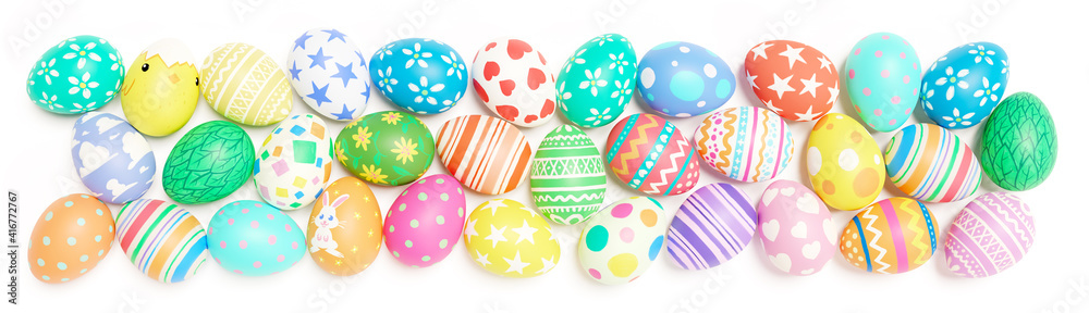 A band of colorful hand painted colorful Easter eggs isolated on a white background.