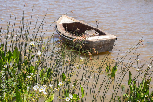 Small leisure boat used by local fisherman at Juan Lacaze's harbour, Colonia, Urugua photo