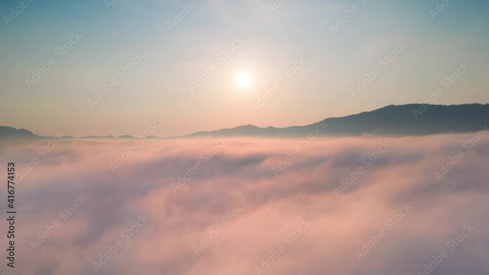 Hyper lapse Drone flight over the clouds during sunrise. Golden hour and amazing sun rays, beautiful cloudscape. Picturesque time lapse of white fluffy clouds moving softly on cloudy, misty weather. Hyper lapse Drone flight over the clouds during sunrise. Golden hour and amazing sun rays, beautiful cloudscape. Picturesque time lapse of white fluffy clouds moving softly on cloudy, misty weather.