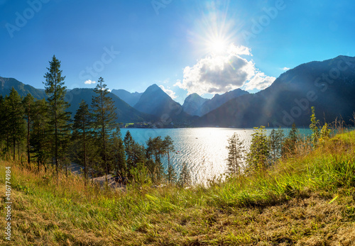 view over turquoise lake achensee to karwendel alps  bright sunshine