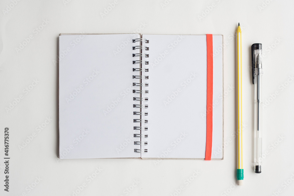 Writing and planning, notepad, pencil and pen, top view, copy space Writing and planning, notepad, pencil and pen, top view, copy space