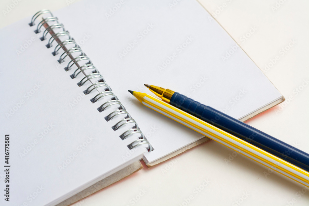 Planning, notepad for writing, pencil and pen, top view Planning, notepad for writing, pencil and pen, top view